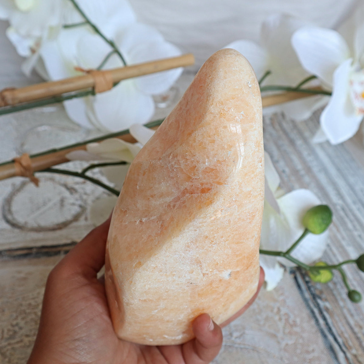 Large Orange Calcite Stone: Free Form Decor on Wooden Stand