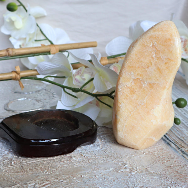 Large Orange Calcite Stone: Free Form Decor on Wooden Stand