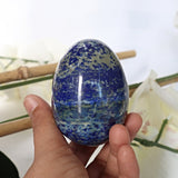 natural blue Lapis Lazuli egg showing white calcite veining