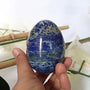 natural blue Lapis Lazuli egg showing white calcite veining