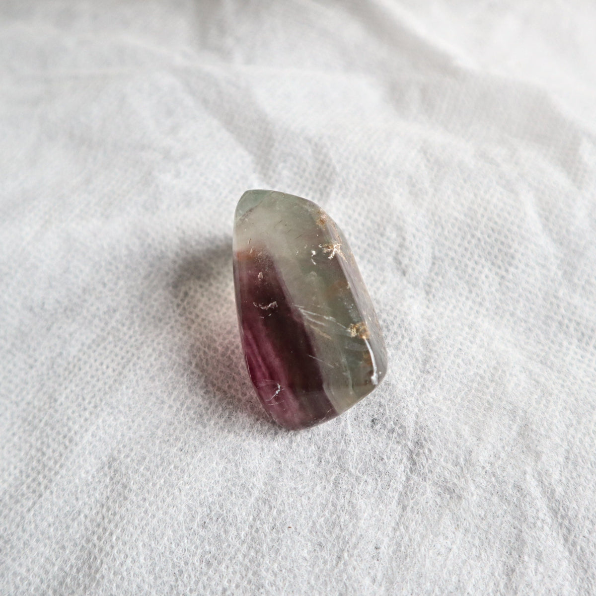 Natural fluorite pocket stone with calming energy