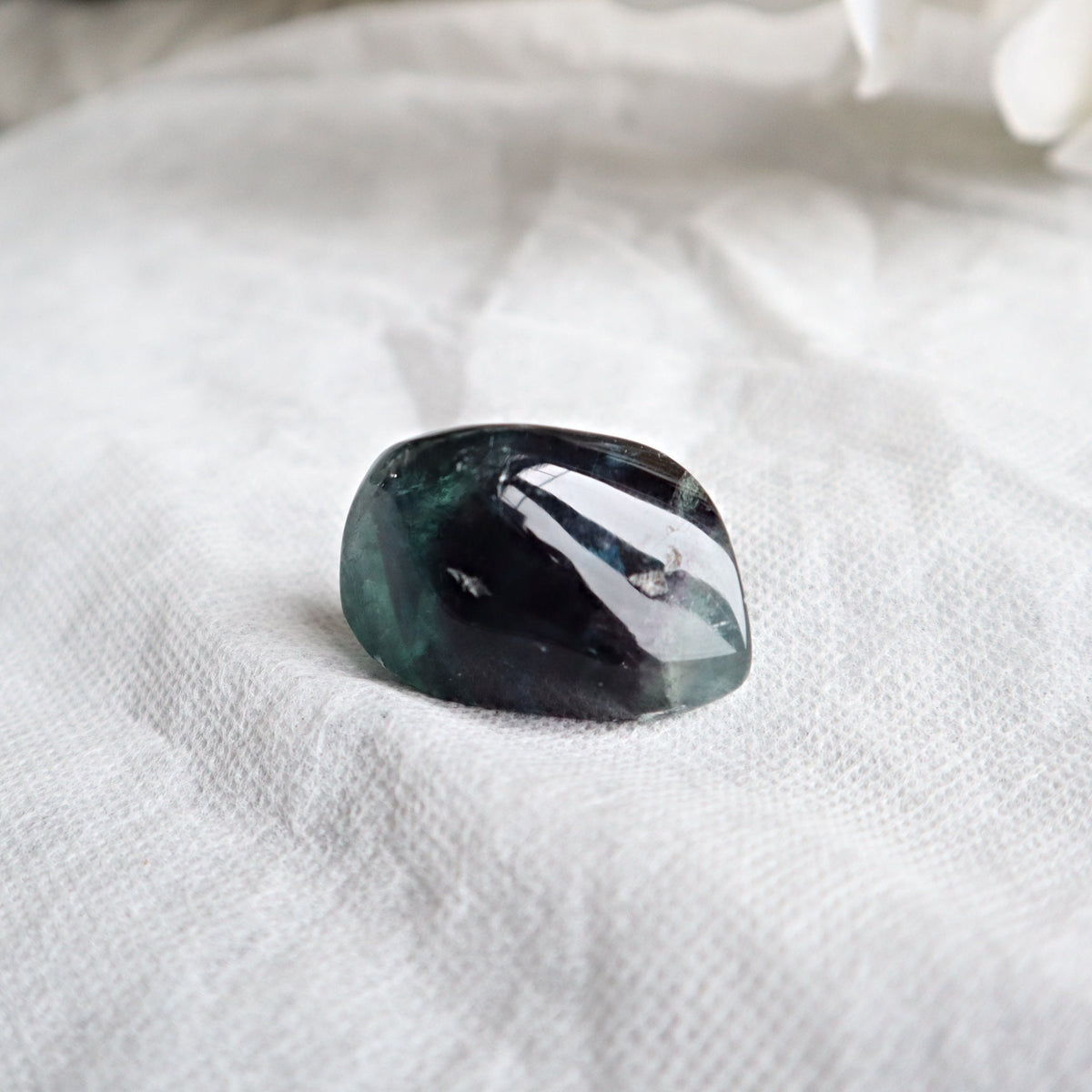 Natural fluorite pocket stone with calming energy