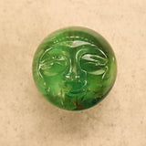 Carved fluorite moon face sphere for lunar healing and intuition