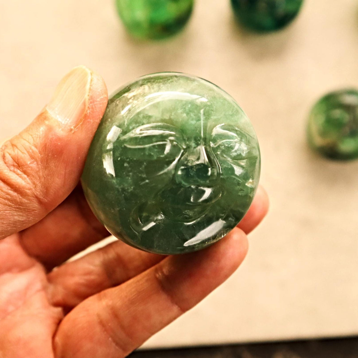 Hand-carved moon face fluorite crystal for emotional healing
