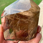 Smoky rutilated quartz tower with golden threads