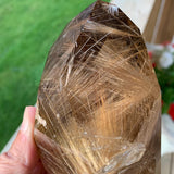 Smoky quartz tower with golden rutile inclusions