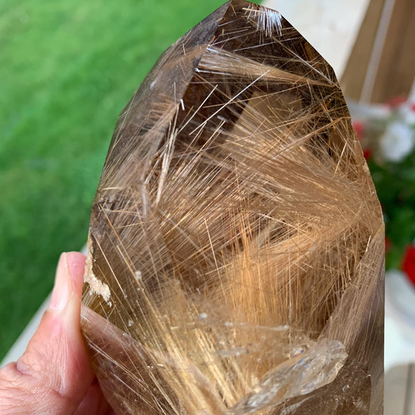 Smoky quartz tower with golden rutile inclusions