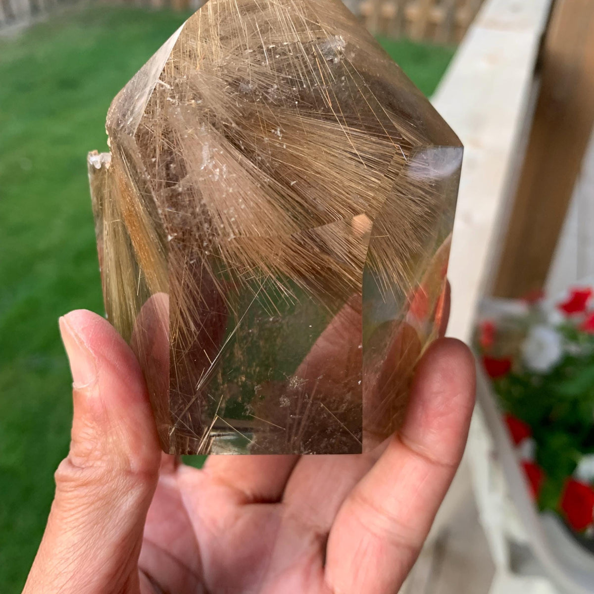 Smoky rutilated quartz tower with golden rutile