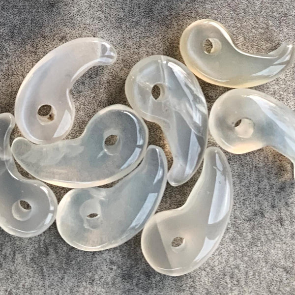 1.	Moonstone Magatama amulet charm with iridescent glow