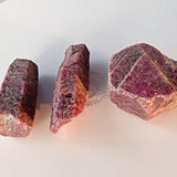 Healing ruby gemstone with raw formation