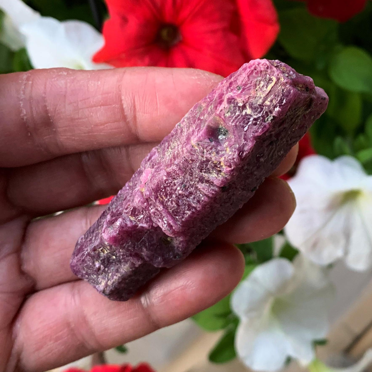 Healing ruby gemstone with raw formation