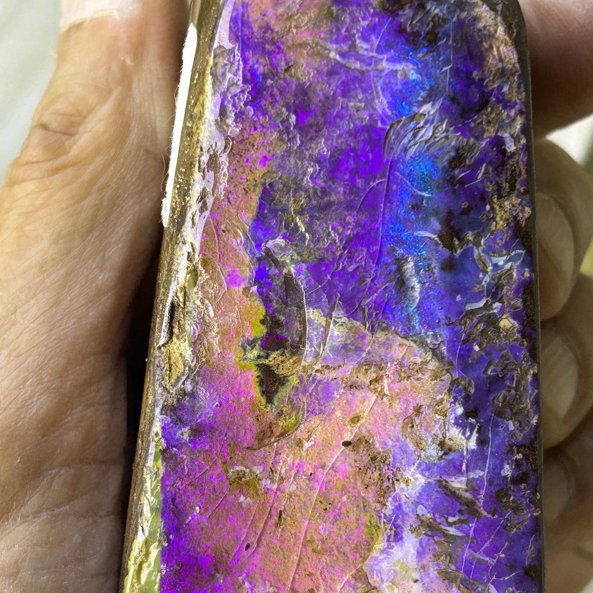 Rare purple pink boulder opal specimen
