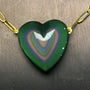 carved rainbow obsidian heart pendant