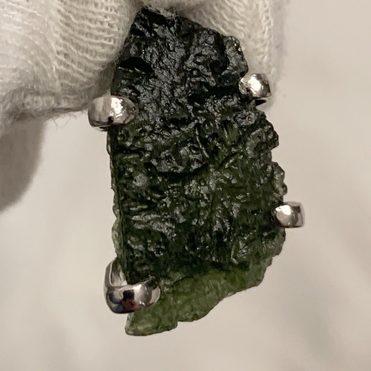 green moldavite crystal pendant close up