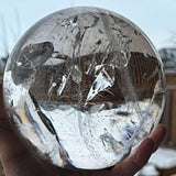 High clarity clear quartz crystal sphere close up