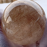 Large rutilated quartz crystal ball