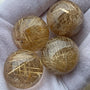 golden rutilated quartz sphere