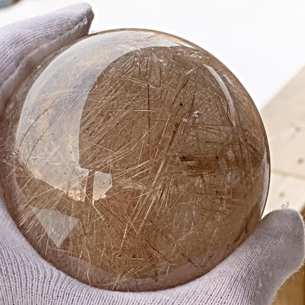 Golden rutilated quartz sphere