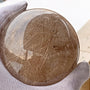 Golden rutilated quartz sphere