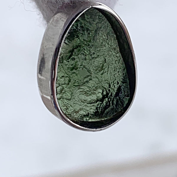 Moldavite teardrop pendant with polished and raw sides