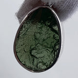 Dual sided moldavite pendant raw and polished view