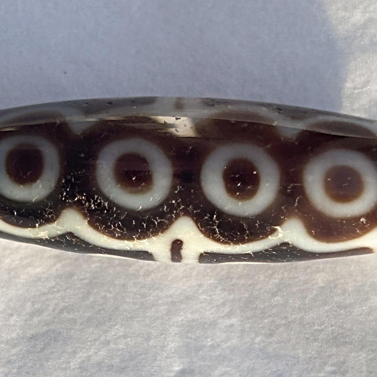 Authentic Tibetan dzi bead close view