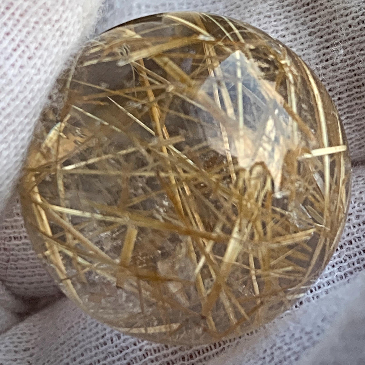 golden rutilated quartz sphere