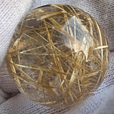 golden rutilated quartz sphere