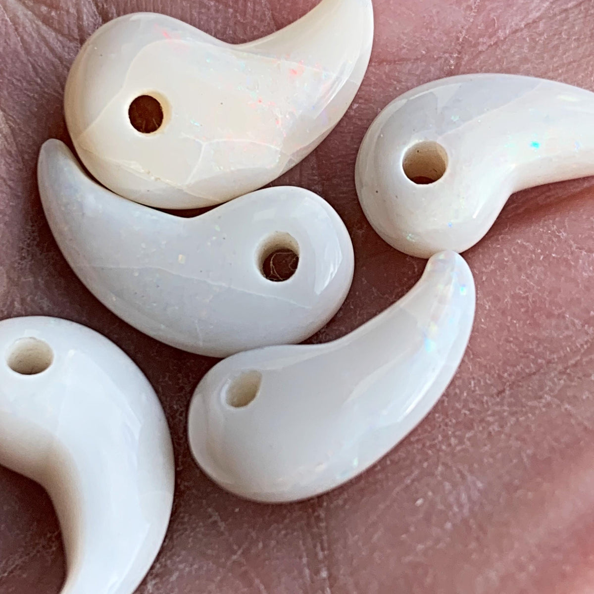 Polished opal magatama spiritual amulet close up