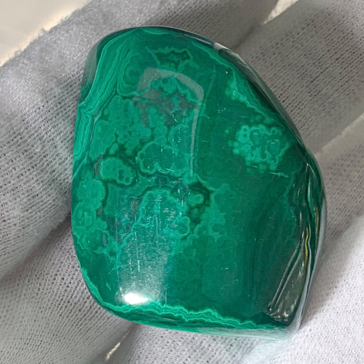 Healing crystal gift: a high-quality malachite pocket stone for heart chakra work.
