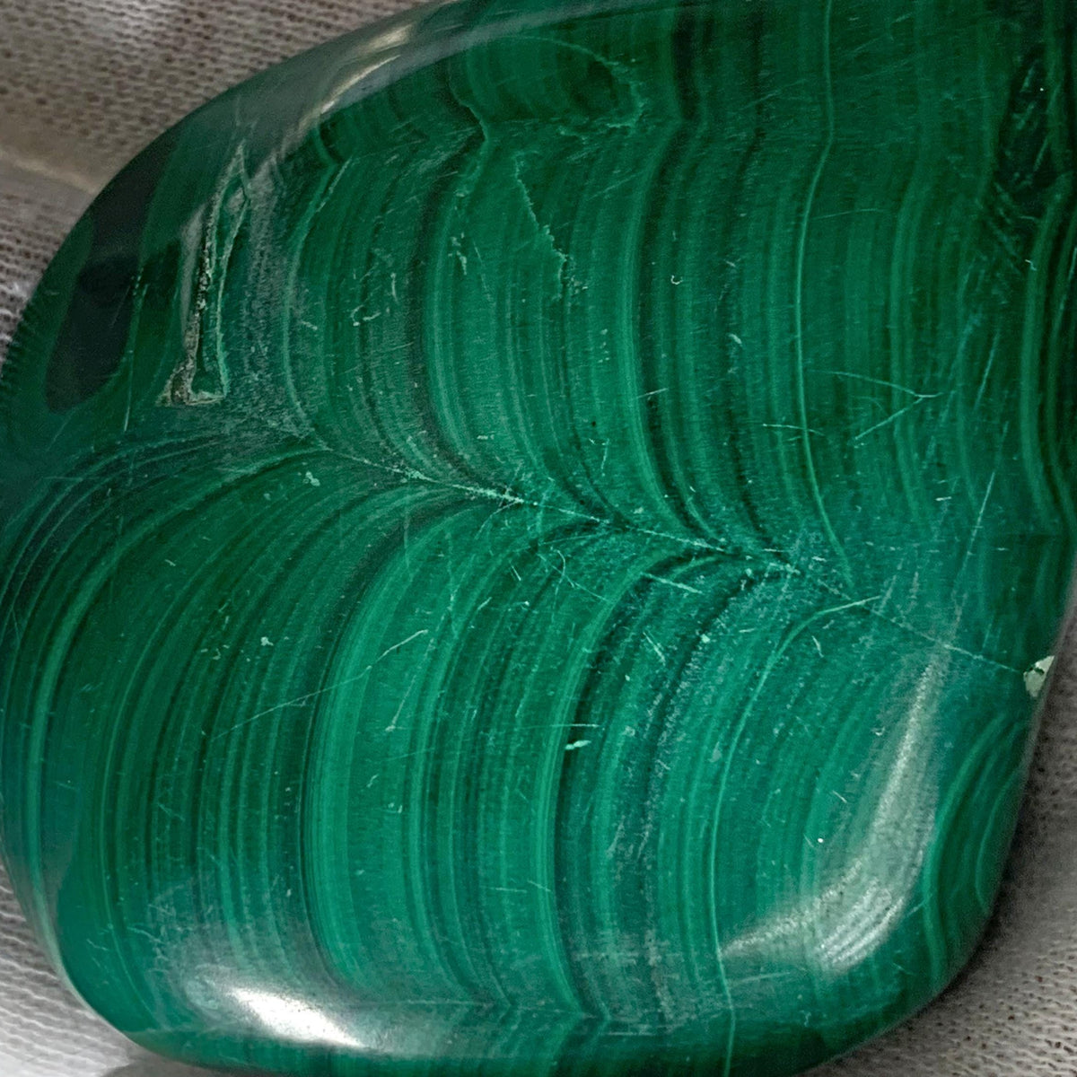 Polished malachite with concentric lines