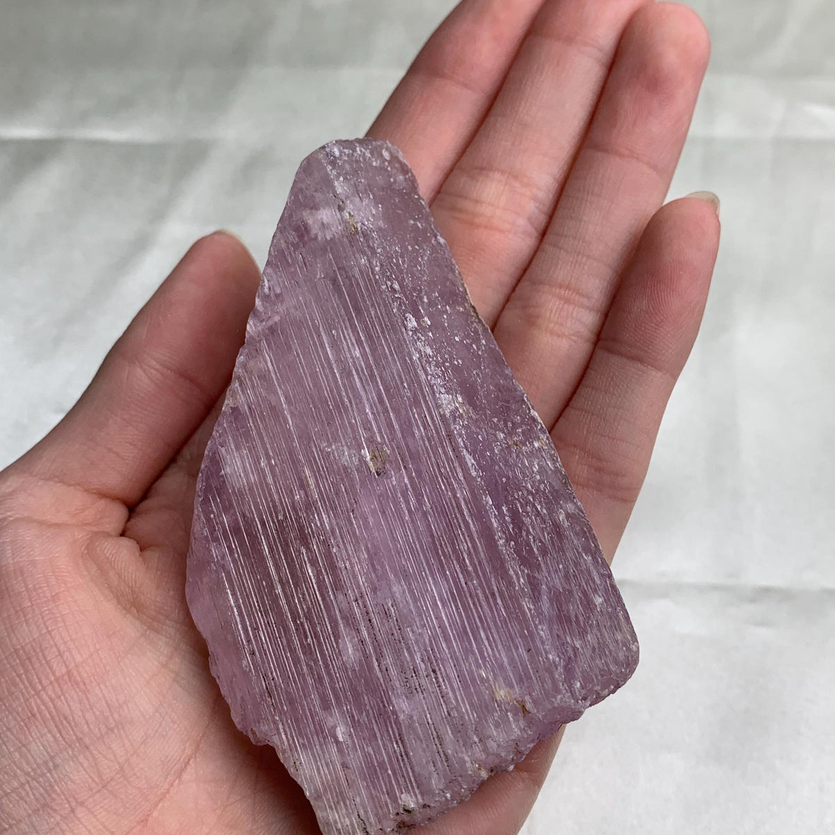 Pink kunzite crystal with etched ridged termination