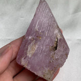 Etched termination kunzite crystal with ridged texture