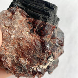 Natural garnet crystals with prismatic black tourmaline