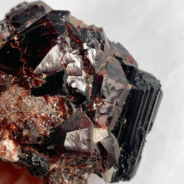 Large garnet with black tourmaline cabinet mineral piece
