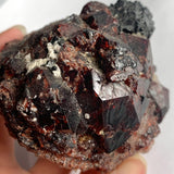 Natural garnet and tourmaline crystal contrast close-up