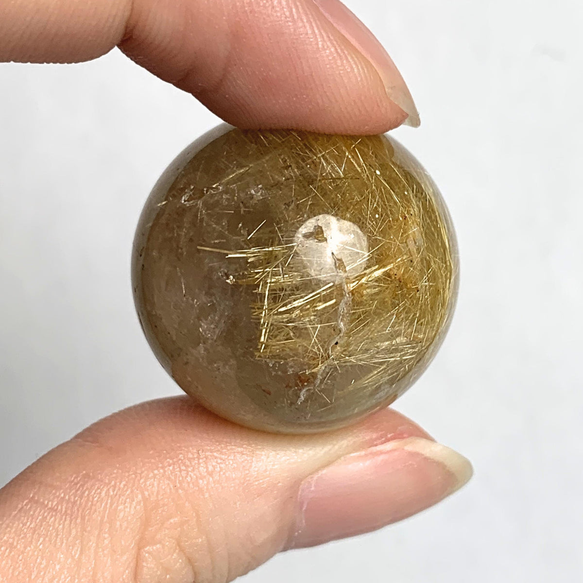 Polished rutilated quartz sphere 25mm