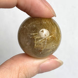 Polished rutilated quartz sphere 25mm