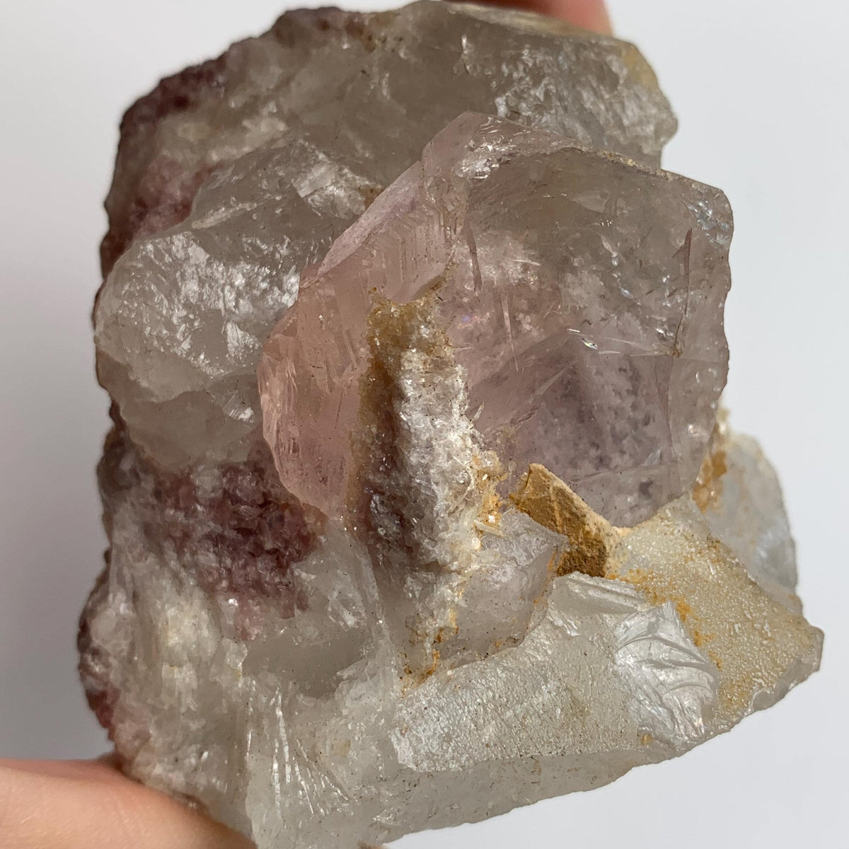 display morganite specimen with quartz crystals on matrix