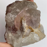 display morganite specimen with quartz crystals on matrix
