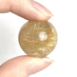 Collector rutilated quartz mineral sphere