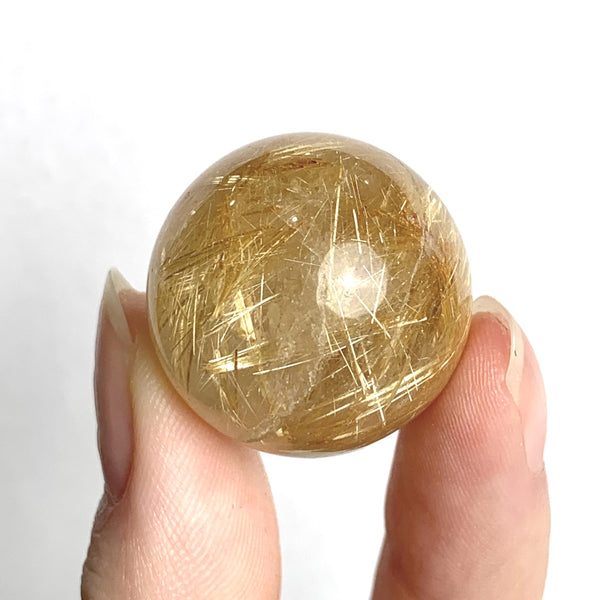 Golden rutile quartz polished crystal ball