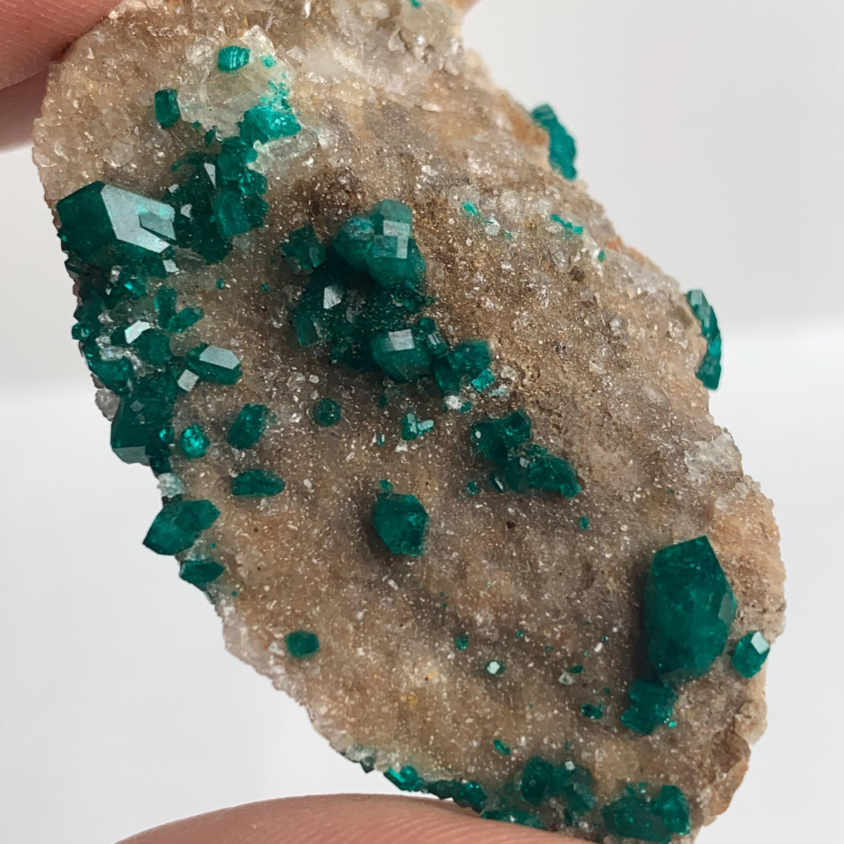 close up of emerald green dioptase specimen
