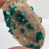 close up of emerald green dioptase specimen
