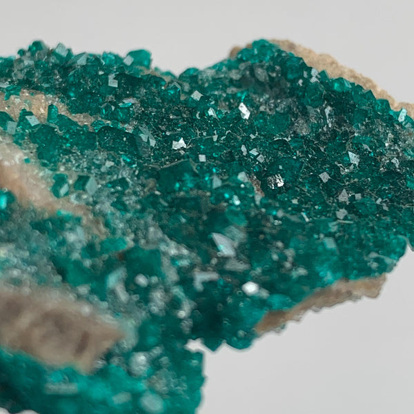 close up of emerald green dioptase specimen