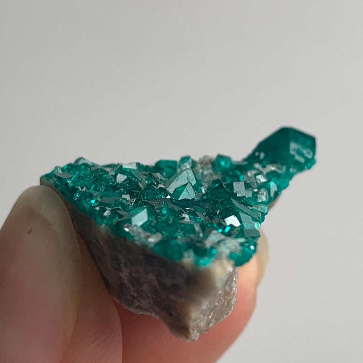 sparkling emerald dioptase crystal surface