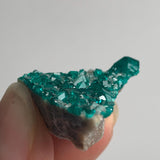 sparkling emerald dioptase crystal surface