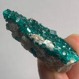 sparkling emerald dioptase crystal surface rock