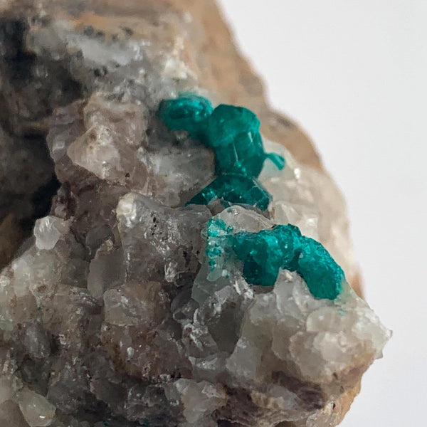 emerald green dioptase crystals on matrix