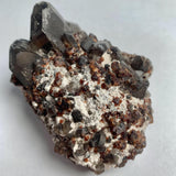 Red garnet crystals with smoky quartz cluster display